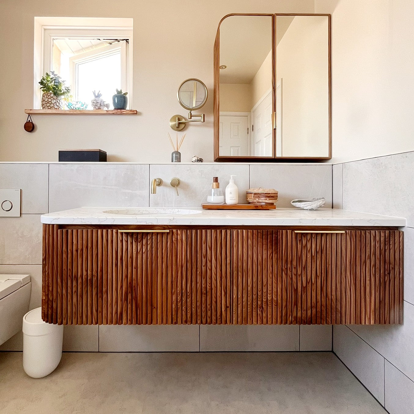 Fluted bathroom vanity cupboard in elm