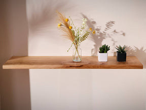 Houseplants on a solid London plane floating wooden shelf